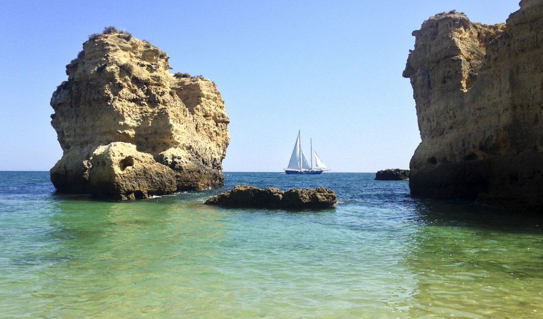 sea-sun-boat-cliff